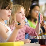 Two young girls with micropipettes